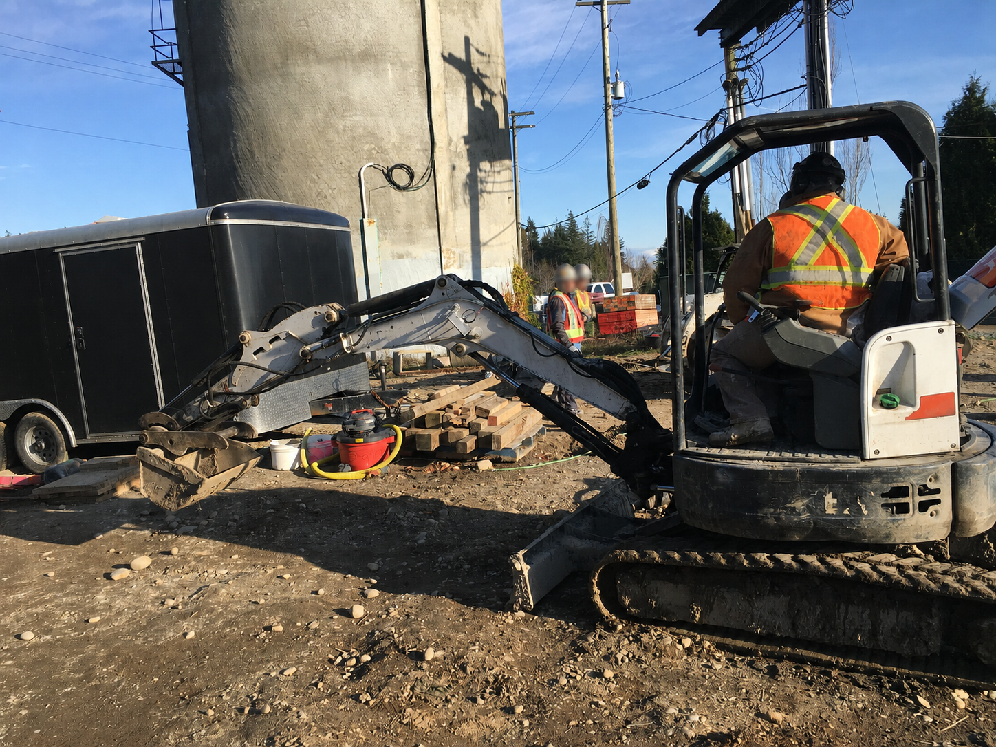 RLW crew operating mini excavator on commercial demolition site